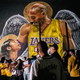 Lakers fans stand in line to celebrate in front of a mural of Kobe Bryant and his daughter Gianna Bryant on October 11, 2020, in Los Angeles, California.